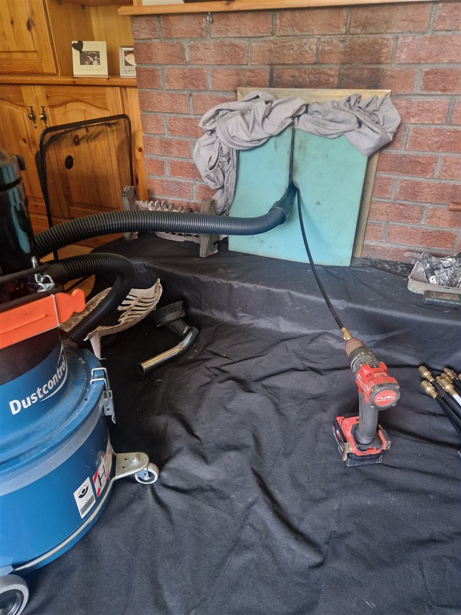 Open fire sealed with board, sheets on the floor